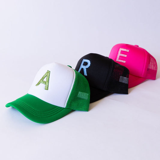 Three Trucker hats embroidered with letters 'A', 'R', 'E' in 3D Puff Weave