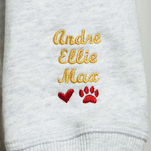 Sleeve embroidery with red heart and dog paw motif